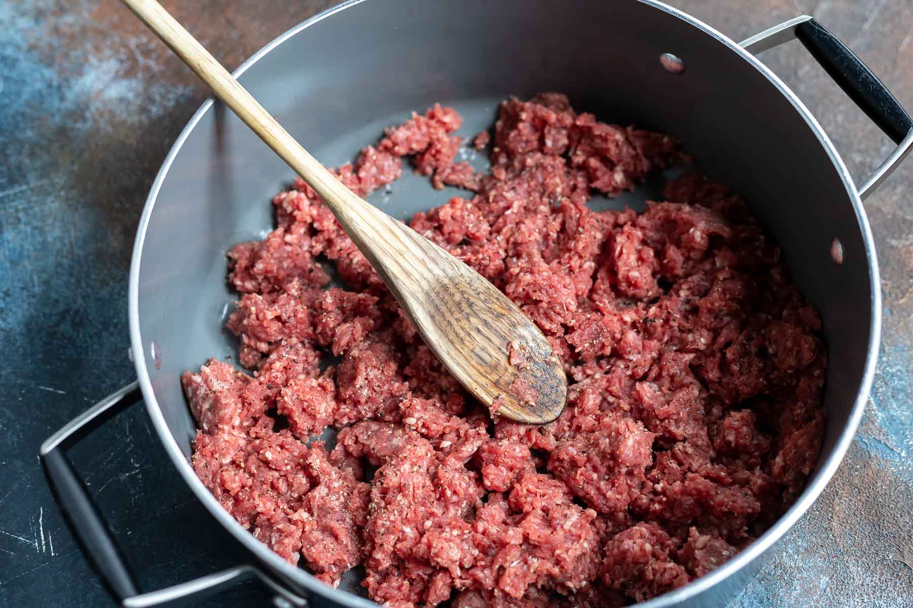 raw ground beef in pot