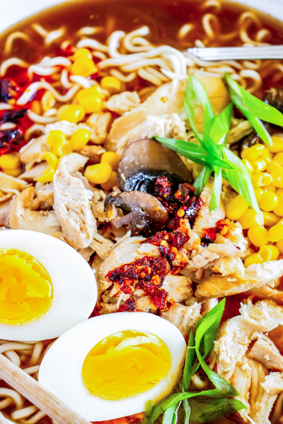 chicken eggs and broth in bowl