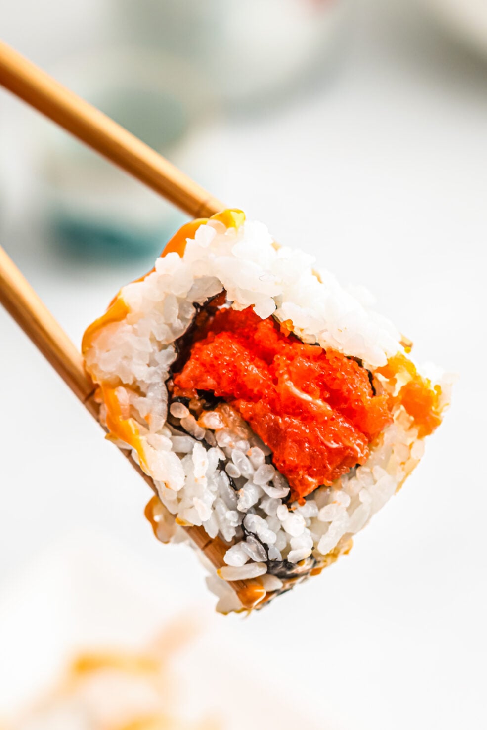chopsticks holding roll