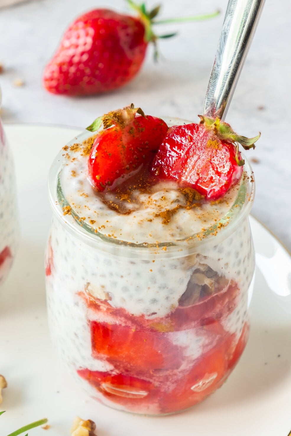 prepared pudding in jar topped with strawberries